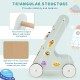 Wooden baby walker in green with a triangular structure, rounded edges, and wheels for toddlers' safe exploration and.