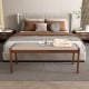 Backless 45-inch farmhouse bench with rubber wood legs and beige fabric padded seat, ideal for bedroom or dining room.