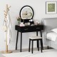 Small black vanity makeup dressing table set with cushioned stool and LED lighted mirror, perfect for compact bedrooms.