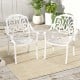 White cast aluminum dining chairs with armrests, stackable design, ideal for outdoor spaces like porches and gardens.