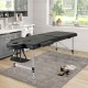 Professional 84-inch black massage bed with adjustable headrest and side armrests, ideal for comfort and portability.