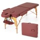Red foldable massage table with a detailed view of the cushioned surface and sturdy wooden legs for stability and.