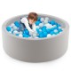 Soft gray Kiddie Baby Playpen filled with 200 ocean balls, perfect for interactive play in living rooms or nurseries.