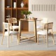 Round glass dining table with sturdy rubber wood legs and a sleek tempered glass top, perfect for various dining.