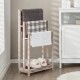 Freestanding towel rack with three bars and bottom shelf, made of solid fir wood, ideal for drying towels in style.