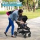 Lightweight black infant stroller with adjustable backrest, 5-point harness, and detachable foot cover for infants 6-36.