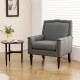 Gray mid-century modern armchair with cushion and nailhead trim, perfect for living rooms or bedrooms.
