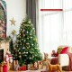 Snowy pre-lit Christmas tree with multi-color lights and hinged design, perfect for festive home decoration.