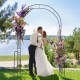 Metal garden arch backdrop stand with floral decorations, perfect for weddings and climbing plants in outdoor settings.