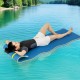 Floating water mat in blue, 7' x 2', with safety tether and pillow design, ideal for lake and pool relaxation.