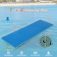 Blue 7' x 2' floating mat with safety tether and pillow design, ideal for relaxing on lakes and pools.