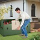 Man lifting a box from a waterproof outdoor storage box with ventilated window, ideal for organizing gardening tools.