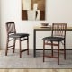 Set of 2 folding counter height chairs with padded seats in brown, perfect for kitchen islands and space-saving storage.