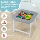 Kid's gray table and chairs set with double-sided tabletop, ideal for drawing and play, featuring large hidden storage.