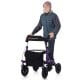 Height adjustable purple rollator walker with seat, large storage bag, and all-terrain wheels for seniors.