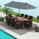 10-piece outdoor dining set featuring a gray double-sided patio umbrella, rattan chairs, and acacia wood tabletop by.