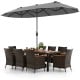 10-piece outdoor dining set featuring a gray double-sided patio umbrella and elegant rattan chairs for backyard.