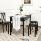 Stackable black dining stools with padded seats, made of solid birch, ideal for space-saving and comfort.