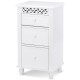 Side view of a white wooden storage organizer cabinet with three drawers, featuring a carved design for versatile home.