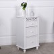 White floor cabinet with three drawers and carved design, ideal for bathroom or living room storage.