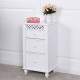 Front view of a white wooden storage cabinet featuring three drawers and elegant carved design, perfect for any room.