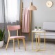 Round side table with faux marble top and golden metal frame, perfect for compact spaces in living rooms or bedrooms.