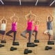 Yoga headstand bench in black with T-shaped cushion, designed for strength building and stability during workouts.