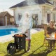 Multifunctional 3-in-1 charcoal BBQ grill with built-in thermometer, shown in use outdoors by a poolside.