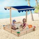 Kids wooden sandbox with adjustable blue canopy, perfect for outdoor play for 2-4 children on the beach.