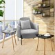 Modern nesting coffee tables with triangular tabletops and bamboo legs, perfect for versatile living room arrangements.