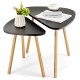 Close-up of a triangular tabletop of a nesting coffee table set with bamboo legs, featuring a smooth surface for easy.