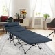 Folding camping cot in blue with removable velvet mattress and pillow, ideal for indoor and outdoor relaxation.