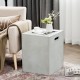 Gray propane tank cover hideaway table with handles, serving as an outdoor side table for garden or patio use.