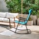 Lightweight folding rocking chair in navy with footrest, ideal for outdoor relaxation on patio or balcony.