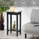 Compact black 2-tier nightstand with solid wood legs, perfect for bedside or sofa side storage and easy maintenance.