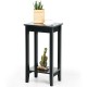 Black 2-tier end table with solid wood legs, ideal for bedside or sofa side storage in a compact design.