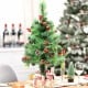Decorative 29-inch pre-lit Christmas tree with rich ornaments, pine cones, and deep green leaves for festive decor.