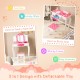 Kids vanity table set with pink polka dot print, featuring a tri-fold mirror, used as a study desk for versatile play.