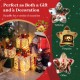 Single large lighted Christmas gift box with a red bow, adorned in snow, perfect for festive tabletop decoration.