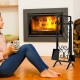 5-piece black wrought iron fireplace tool set with decorative holder, including brush, poker, shovel, and tongs.