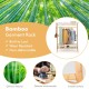 Bamboo garment rack with storage shelves, featuring a hanging rod and two-tier shelves for versatile organization.