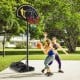 Portable adjustable basketball hoop system with 41-inch backboard, suitable for all ages, set up outdoors for play.