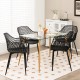 Set of 4 black modern dining chairs with airy hollow backrest, featuring sturdy metal legs, ideal for indoor dining.
