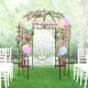 Birdcage shape garden arbor in vintage bronze, adorned with flowers and balloons, perfect for outdoor events and.