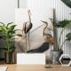 Set of 2 standing metal crane garden statues with detailed feathers, ideal for backyard or lakeside decoration.