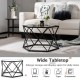 Hexagonal black geometric coffee table with tempered glass top, perfect for displaying cups and books in modern living.