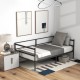 Twin size metal daybed frame in modern style with gray bedding, ideal for living room or bedroom use.