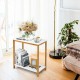 Compact 23-inch end table with a bamboo frame and white MDF top, styled with decorative items for a modern touch.