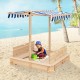 Kids wooden sandbox with blue canopy and bench seats, providing shade and a safe play area for outdoor fun.