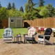 Three patio Adirondack chairs with cushions in black, gray, and beige, set in a garden for outdoor relaxation.